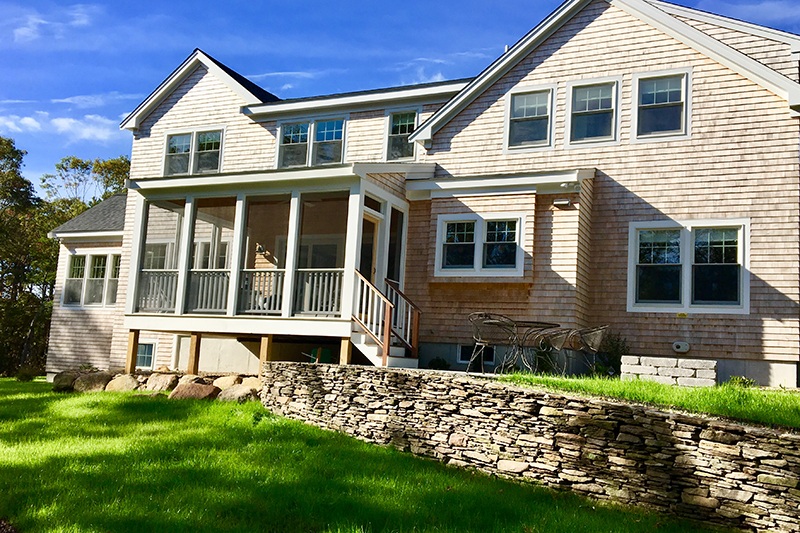 New home on Cape Cod with stone wall